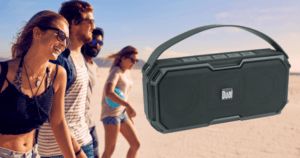 women with portable speaker at beach