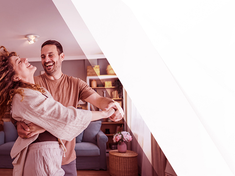couple dancing to music from dual home speaker line