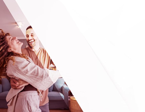couple dancing to bookshelf speaker